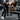 Woman exercising with dumbbells on a gym bench