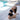 Woman practicing yoga by a poolside.
